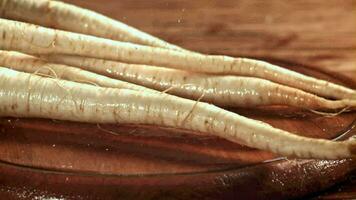 Parsley root falls on a cutting board. Filmed on a highspeed camera at 1000 fps. High quality FullHD footage video