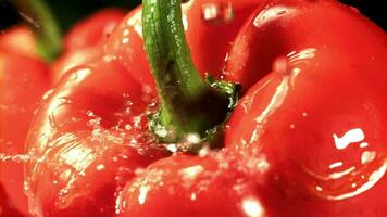 Drops of water fall on sweet peppers. Macro shot. Filmed on a highspeed camera at 1000 fps. High quality FullHD footage video