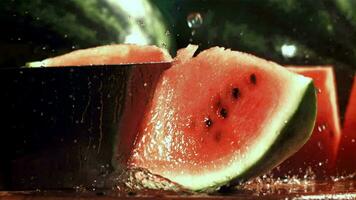 A knife cuts a watermelon. Filmed on a highspeed camera at 1000 fps. High quality FullHD footage video