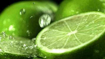 Drops of water fall on a cut lime. Filmed on a highspeed camera at 1000 fps. High quality FullHD footage video
