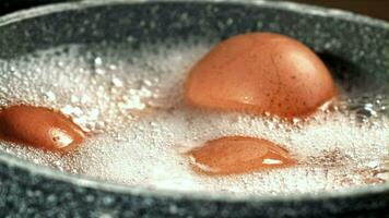 Eggs in boiling water. Filmed on a highspeed camera at 1000 fps. High quality FullHD footage video
