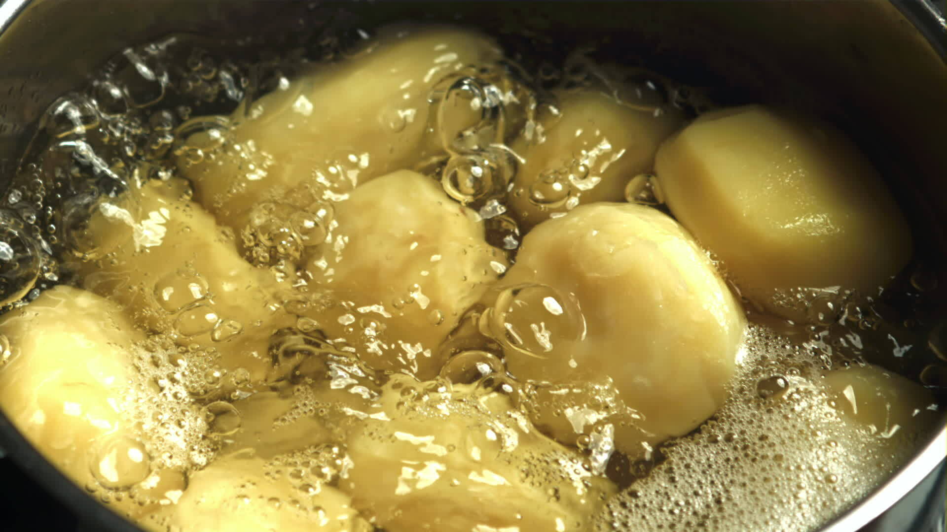 Potatoes in boiling water. Filmed on a highspeed camera at 1000 fps