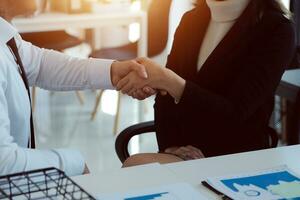 Business handshake for teamwork of business merger and acquisition,successful negotiate,hand shake,two businessman shake hand with partner to celebration partnership and business deal concept photo