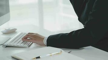 Service phone operators sit at shared desk focus on sales agent woman in headset use pc answers incoming calls talk with client provide professional support to customers sell company product concept video