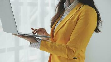 Businesswoman using calculators for do math finance on wooden desks in office and business working background, tax, accounting, statistics, and analytic research concept video