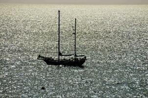 a sailboat in the ocean photo