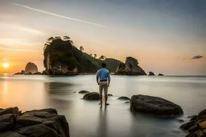 a man standing on rocks at the beach at sunset. AI-Generated photo