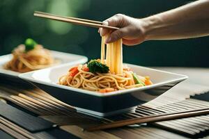 a person holding chopsticks over a bowl of noodles. AI-Generated photo