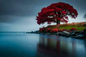 a red tree stands alone on the shore of a lake. AI-Generated photo