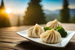 three dumplings on a white plate with a sunset in the background. AI-Generated photo
