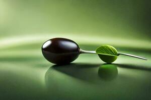 a black ball with a green leaf on it. AI-Generated photo