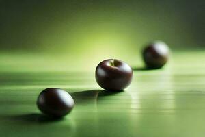 three chocolate apples on a green surface. AI-Generated photo