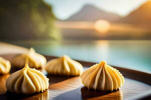 four dumplings on a wooden tray with a lake in the background. AI-Generated photo