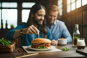 a man and woman are eating a burger at a table. AI-Generated photo