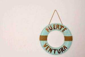 a wooden sign with the words fuerte ventura on it photo