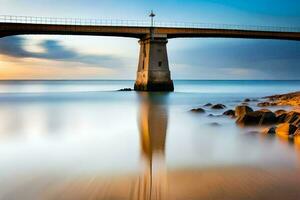 un largo exposición fotografía de un puente terminado el océano. generado por ai foto