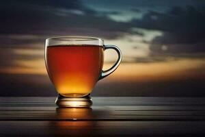 a glass cup of tea on a table with a sunset in the background. AI-Generated photo