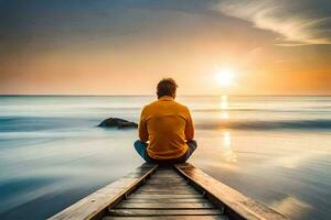 man sitting on a wooden dock looking out at the ocean at sunset. AI-Generated photo