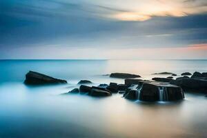 a long exposure photograph of rocks and water at sunset. AI-Generated photo