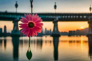 a pink flower hanging from a hook in front of a bridge. AI-Generated photo