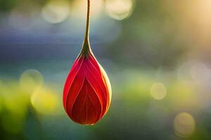 a red flower hanging from a string. AI-Generated photo