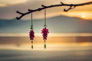 two pink flowers hanging from a branch in front of a lake. AI-Generated photo