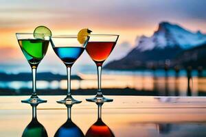 three glasses of colorful drinks with mountains in the background. AI-Generated photo