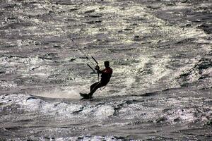 A person surfing in the sea photo