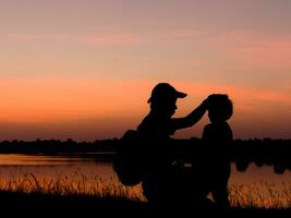 Male tourists standing by the telethon at sunset. photo