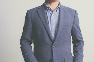 Businessman wearing a suit on a white background photo