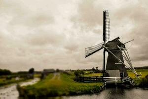 a windmill on the water photo