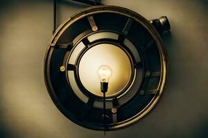 a light bulb is on a wall in front of a circular light. AI-Generated photo