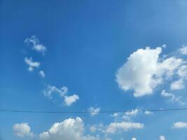 white clouds in the blue summer sky natural background photo