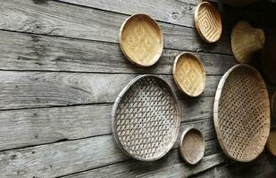 The light brown wooden basket looks beautiful as a wall decoration in the home or garden. photo