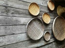 The light brown wooden basket looks beautiful as a wall decoration in the home or garden. photo