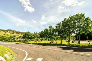 Road through the scenic landscape photo