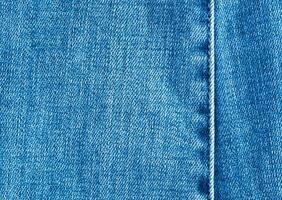 Texture and seam of denim fabric photo