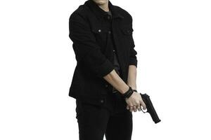 man holding a gun like a secret agent on a white background photo