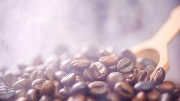 Coffee beans roasting with smoke,  selective focus, and soft focus. photo