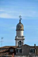 a tower on top of a building with a blue sky photo