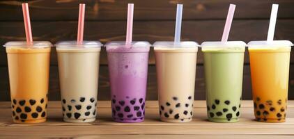 Plastic cups of different tasty bubble tea on wooden background. Generative AI photo