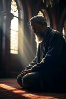 Muslim man praying inside the mosque in the rays of the setting sun AI Generative photo