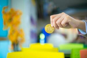 Golden bitcoin in the hand, Digital money concept, Finance and management concept, Business for future concept. photo