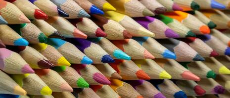 side view, Stacked crayons, Close-up showing different colors as a background, Background concept, Education concept photo