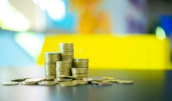 Pile of gold coins on a black table, Finance and management concept, Concept of saving money for the future. photo