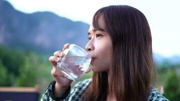 Woman drinking water in a glass video