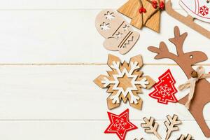 Top view of Christmas decorations and toys on wooden background. Copy space. Empty place for your design. New Year concept photo