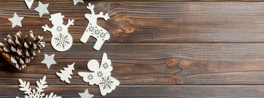 Top view of Banner Christmas decorations and toys on wooden background. Copy space. Empty place for your design. New Year concept photo