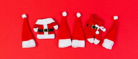 Banner Top view red Santa hats on colorful background. Time for holiday concept with empty space for your design photo