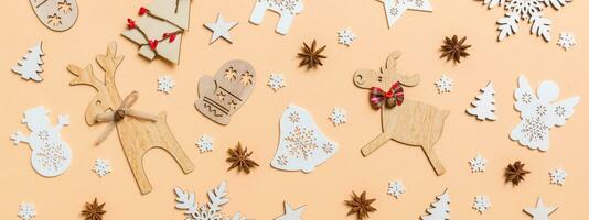 Festive decorations and toys on orange background. Merry Christmas Banner concept photo